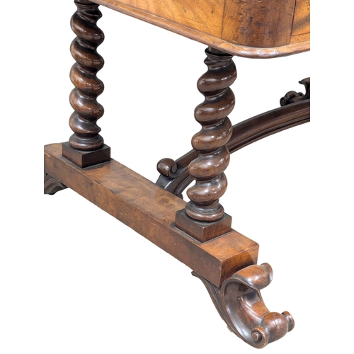 819 - A large Early Victorian mahogany library table with Barley Twist supports raised on Cabriole legs. 1... 