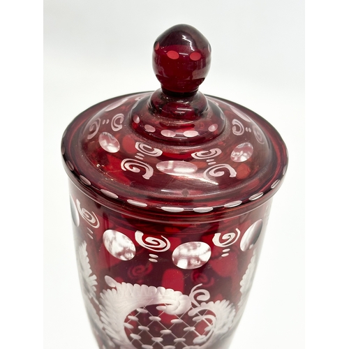 116 - Friedrich Egermann. An Early 20th Century Bohemian ruby glass jar urn with cover. By Egermann. 27cm