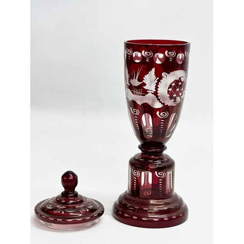 116 - Friedrich Egermann. An Early 20th Century Bohemian ruby glass jar urn with cover. By Egermann. 27cm