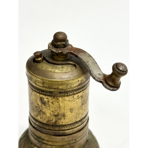 201 - A Late 19th Century brass spice grinder. 11cm.