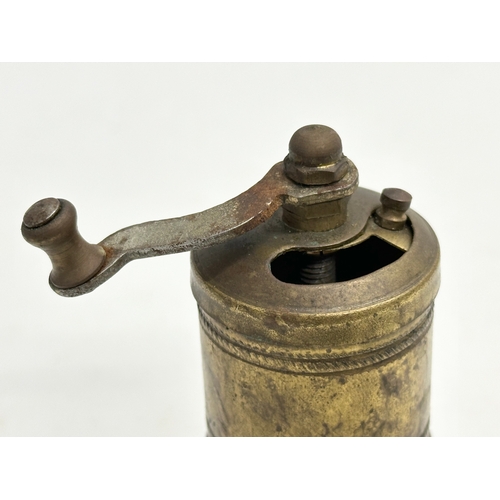 201 - A Late 19th Century brass spice grinder. 11cm.