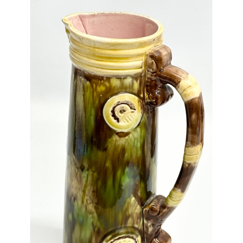 203 - A large Late 19th Century Majolica pitcher. 30cm.