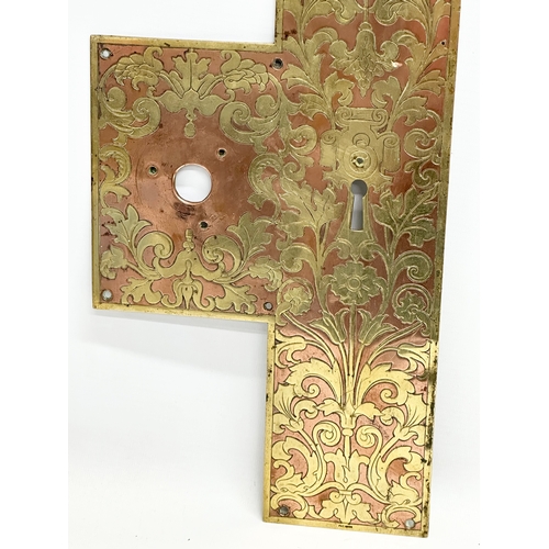 199 - A large Late 19th Century brass and copper door plate. 19x56.5cm