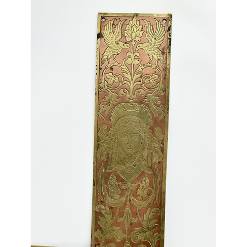 199 - A large Late 19th Century brass and copper door plate. 19x56.5cm