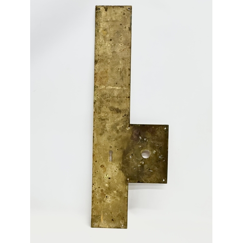 199 - A large Late 19th Century brass and copper door plate. 19x56.5cm