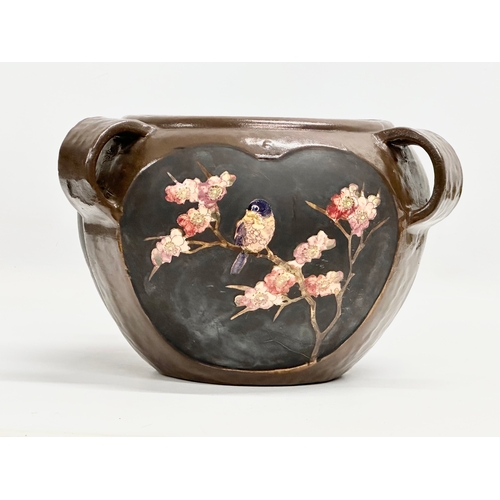 232 - An Early 20th Century Arts & Crafts 3 handled jardiniere by Bretby. Circa 1900-1910. 27x26x17cm.