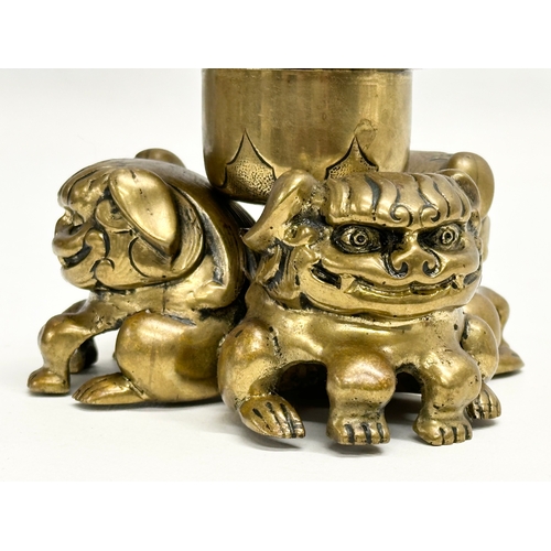 234 - A Late 19th Century brass foo dog ink well with Bristol Blue liner. 11.5x8.5cm.