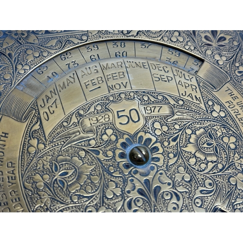 239 - An engraved brass year calendar. 17x17cm