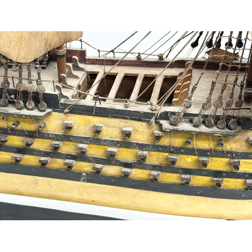 213 - A large Early 20th Century model of HMS Victory. Ship measures 65x71cm