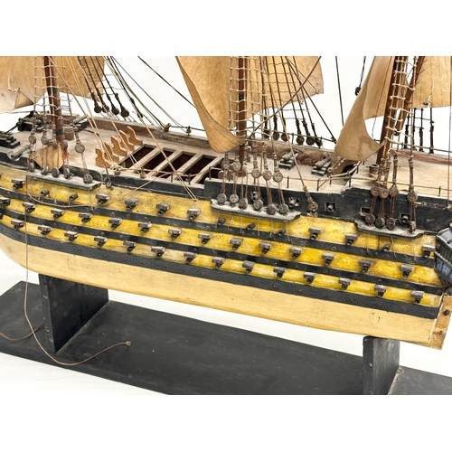 213 - A large Early 20th Century model of HMS Victory. Ship measures 65x71cm