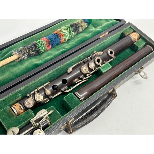 452 - A Boosey & Co flute in case.