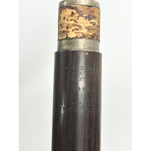 452 - A Boosey & Co flute in case.