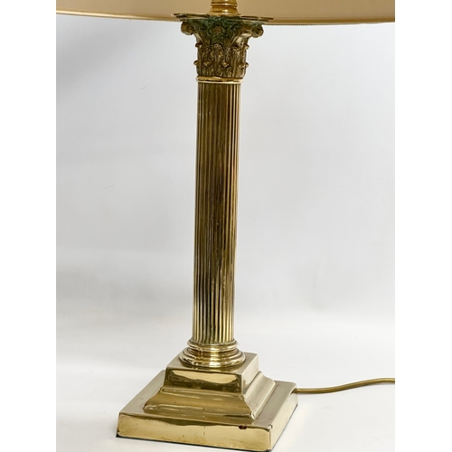 230 - A large vintage brass table lamp with Corinthian style column. 57x74cm