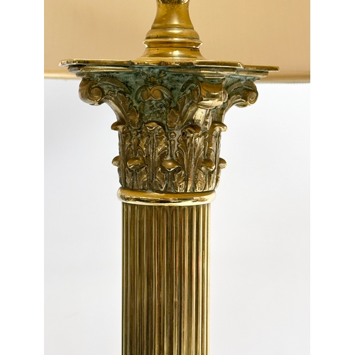 230 - A large vintage brass table lamp with Corinthian style column. 57x74cm