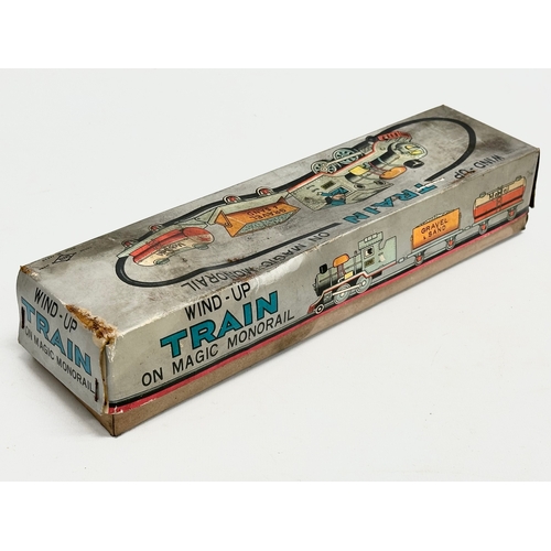 422 - A vintage Daiya Windup Train On Magic Monorail in original box.