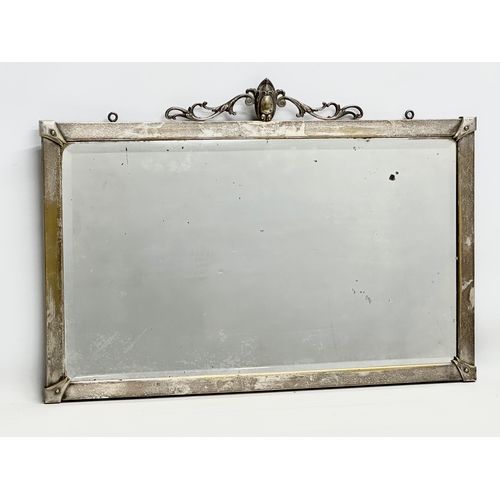 267 - An Early 20th Century plated brass framed mirror. Circa 1900-1910. 66x46cm.