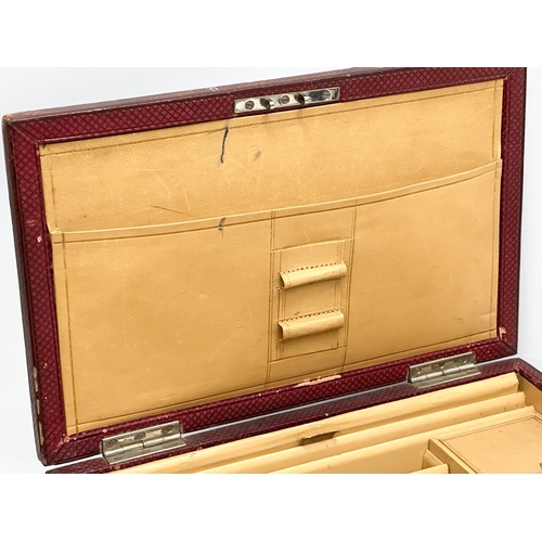 270 - A Late 19th/Early 20th Century leather bound fall front stationary box. Circa 1890-1910. 30x19x25cm ... 