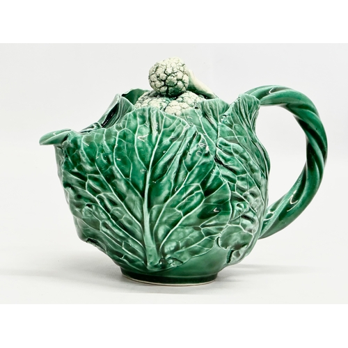 336 - A 20th Century cabbage teapot with Pegasus mark. In the manner of Dodie Thayer. 20x11x14cm