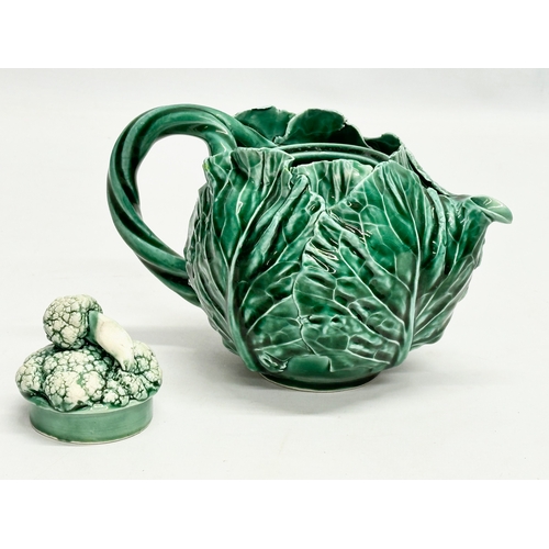 336 - A 20th Century cabbage teapot with Pegasus mark. In the manner of Dodie Thayer. 20x11x14cm