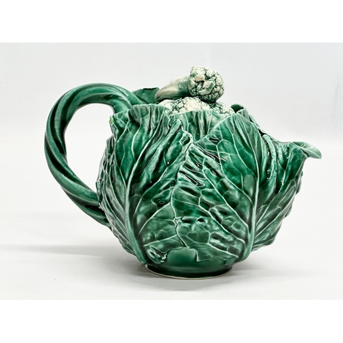 336 - A 20th Century cabbage teapot with Pegasus mark. In the manner of Dodie Thayer. 20x11x14cm