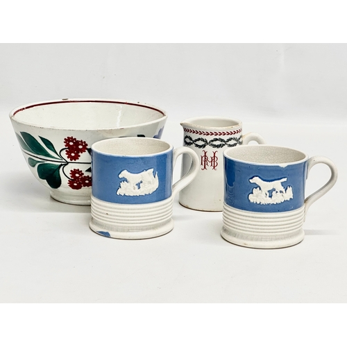 366 - A collection of 19th Century pottery and a 20th Century cream jug. A pair of Mid 19th Century mugs, ... 