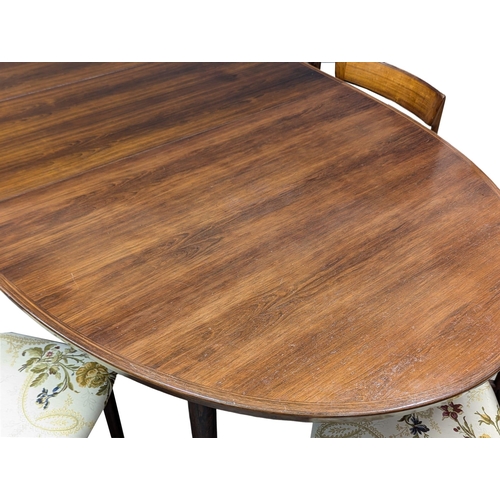 805 - A excellent quality Danish Henry Rosengren Hansen Mid Century rosewood extending dining table with 8... 