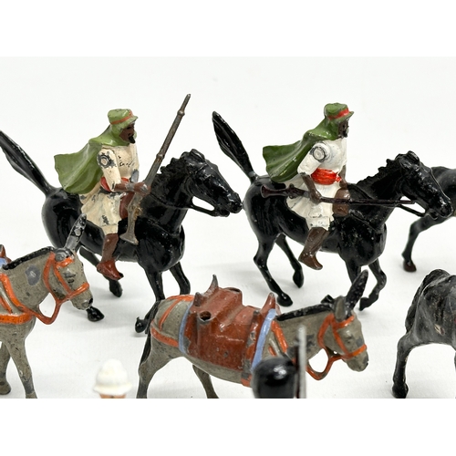A collection of vintage lead model soldiers and cavalry.
