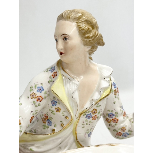 344 - John Bevington. A large Late 19th Century hand painted pottery figurine sweetmeat basket by John Bev... 