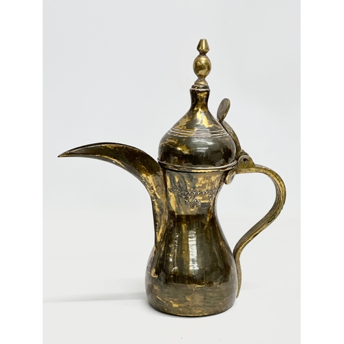 359 - A Late 19th Century Saudi Arabian brass dallah pot, together with an Early 20th Century Chinese bras... 