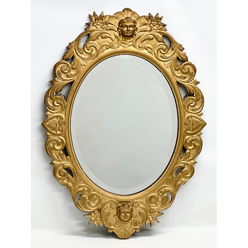 364 - An Early 20th Century gilt wooden framed bevelled mirror. 65x91cm.