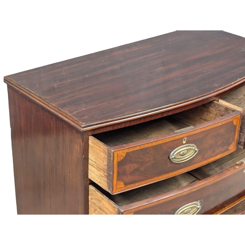 807 - A George III inlaid mahogany oak lined bow front chest of drawers. Circa 1800. 105x52x98cm (3)