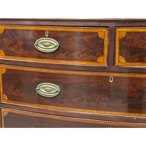 807 - A George III inlaid mahogany oak lined bow front chest of drawers. Circa 1800. 105x52x98cm (3)