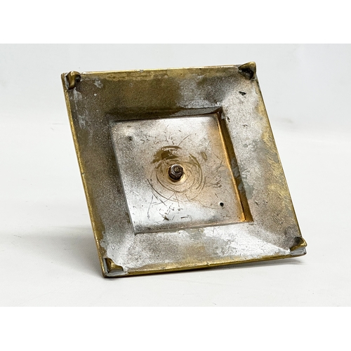 384 - A Late 19th/Early 20th Century brass inkwell. 13x13x8cm.