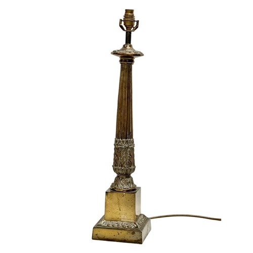 387 - A large Mid 20th Century brass table lamp with reeded column. 64cm