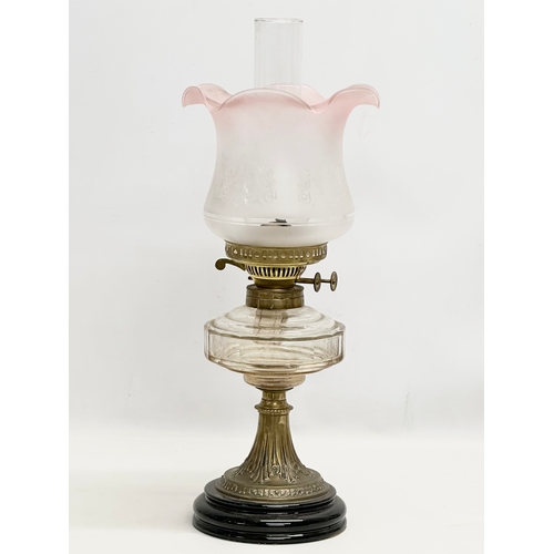 254 - A Late 19th Century Victorian double burner oil lamp. With later shade. 54cm