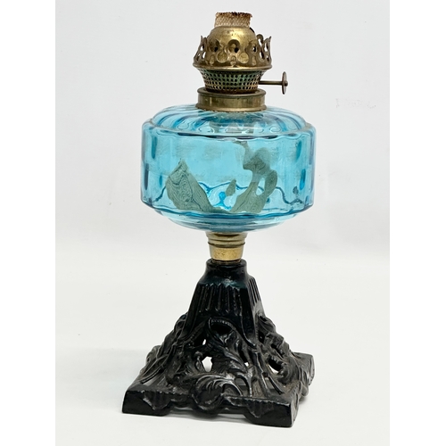 255 - A Late 19th Century Victorian oil lamp with blue glass bowl. 29cm