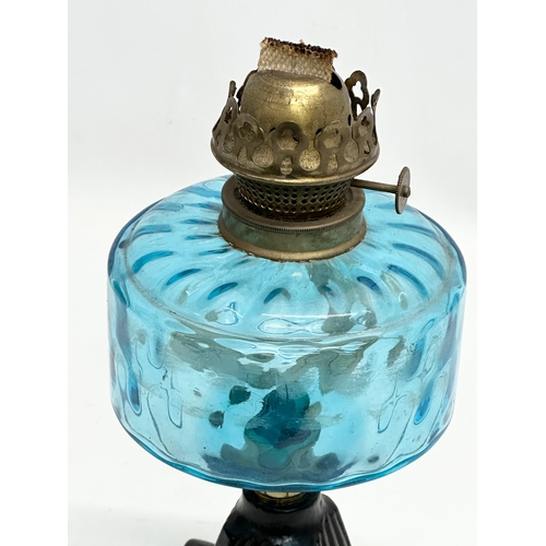 255 - A Late 19th Century Victorian oil lamp with blue glass bowl. 29cm