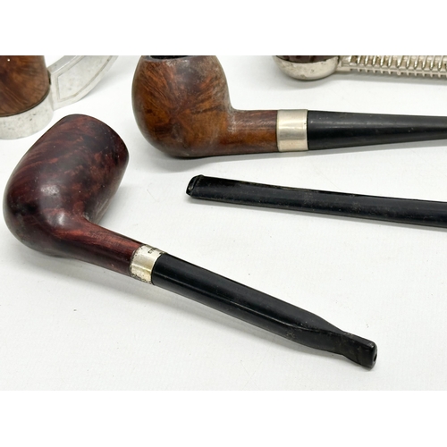 424 - A collection of smokers pipes. 1 silver mounted.