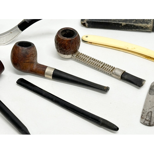 424 - A collection of smokers pipes. 1 silver mounted.