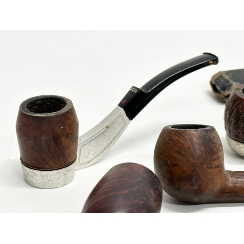 424 - A collection of smokers pipes. 1 silver mounted.