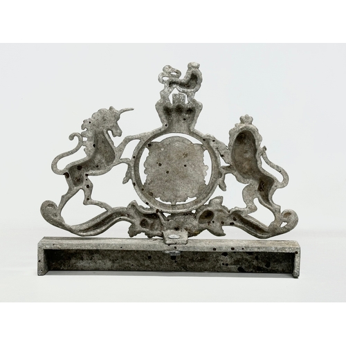 317 - A vintage cast alloy United Kingdom Coat of Arms. 29.5x24.5cm.