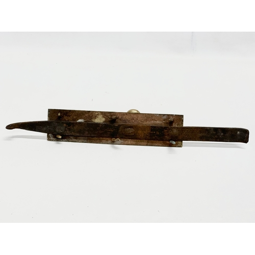 320 - A Victorian brass door bolt. 41cm