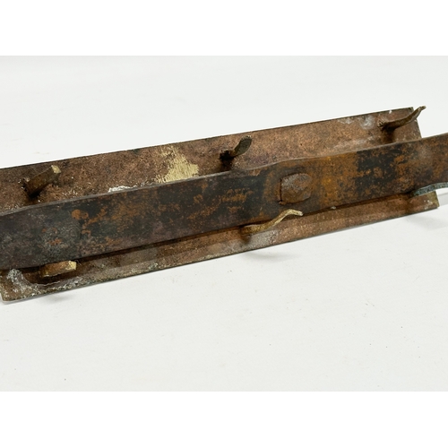 320 - A Victorian brass door bolt. 41cm