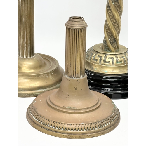 320B - A collection on Victorian brass oil lamp bases. 37cm