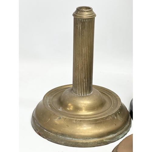 320B - A collection on Victorian brass oil lamp bases. 37cm