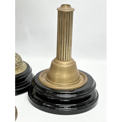 320B - A collection on Victorian brass oil lamp bases. 37cm