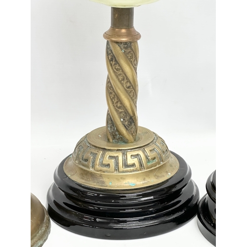 320B - A collection on Victorian brass oil lamp bases. 37cm