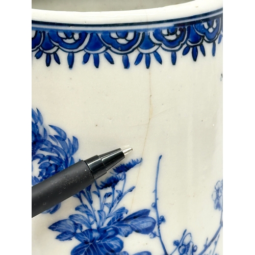 246A - A 19th Century Chinese blue and white cylinder vase. With hand painted sunflowers, trees and prunus ... 