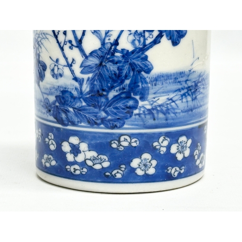 246A - A 19th Century Chinese blue and white cylinder vase. With hand painted sunflowers, trees and prunus ... 