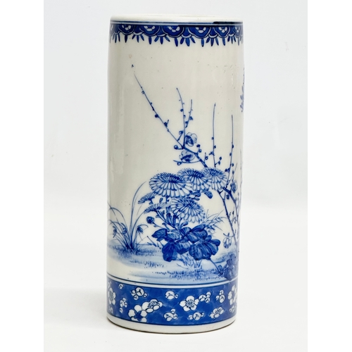 246A - A 19th Century Chinese blue and white cylinder vase. With hand painted sunflowers, trees and prunus ... 